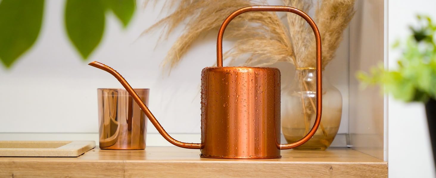 Rose gold watering can in dining room and kitchen setting