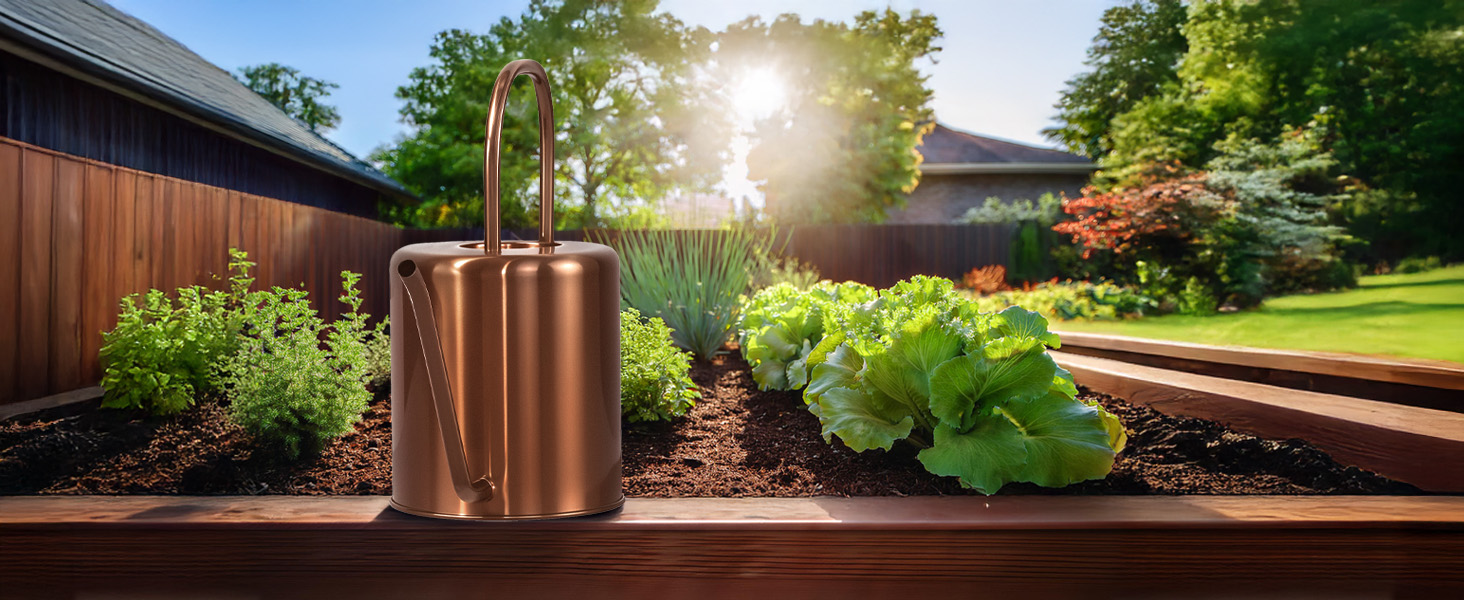 Rose gold watering can in backyard garden setting
